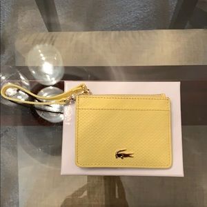 Lacoste yellow card case with wristlet